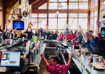 people cheering for a sport at the Sports Bar