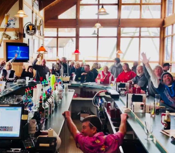 people cheering for a sport at the Sports Bar