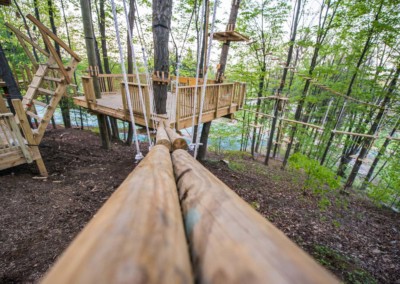 wooden balance beams on aerial adventure course