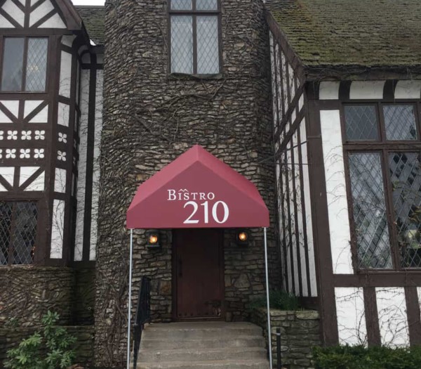 bistro 210 exterior front entrance with red awning