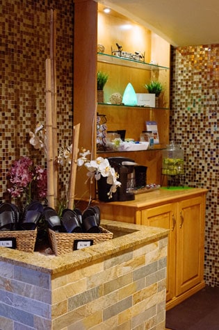 serenity spa interior with baskets of sandals and flowers