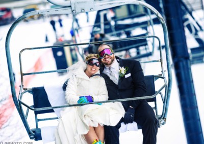 married couple riding chair lift ride