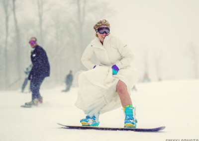 married couple snowboarding together