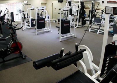 fitness center with various pieces of workout equipment