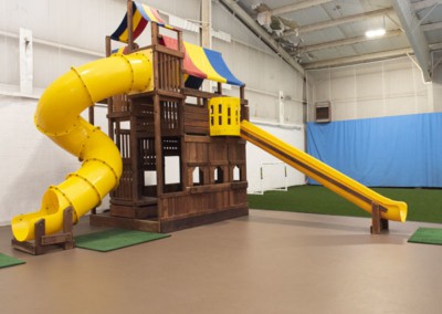 Indoor playground with yellow slides