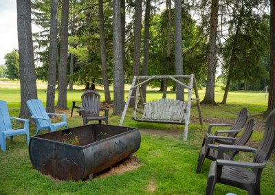 fire pit surrounded by chairs