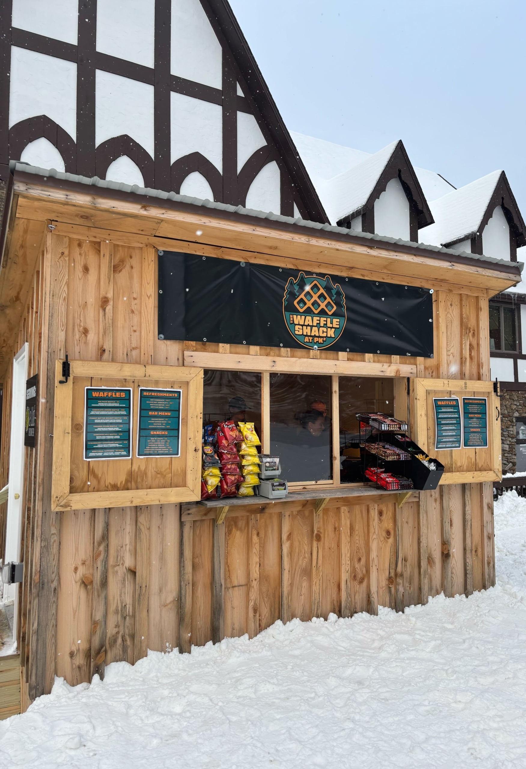 exterior of the inn at the peak in the summer with clear sky